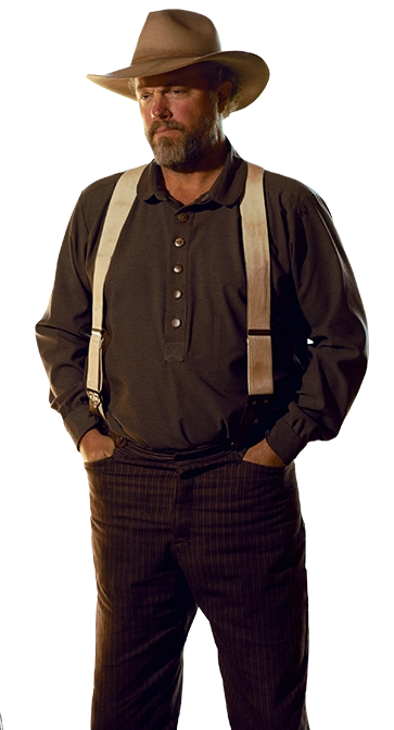 Adam Baldwin as Sam Barnes in The Legend of 5 Mile Cave. He has a cowboy hat on, suspenders, and his hands in his pockets.