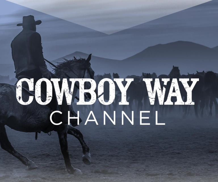 A man on horseback with his back turned towards an open field of cattle and a reins in his hands. The image has a blue overlay on top of it and Cowboy Way Channel in white font.